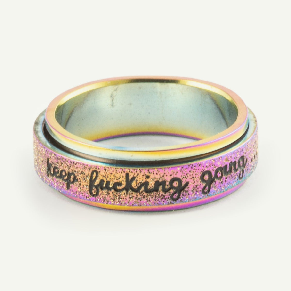 Anillo Anti-Estrés Deslizante Keep fuck*ng going Tornasol