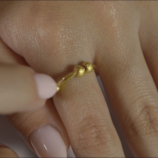 Anillo Anti-Estrés Deslizante Bolitas Julio Dorado