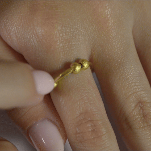Anillo Anti-Estrés Deslizante Bolitas Julio Dorado en movimiento