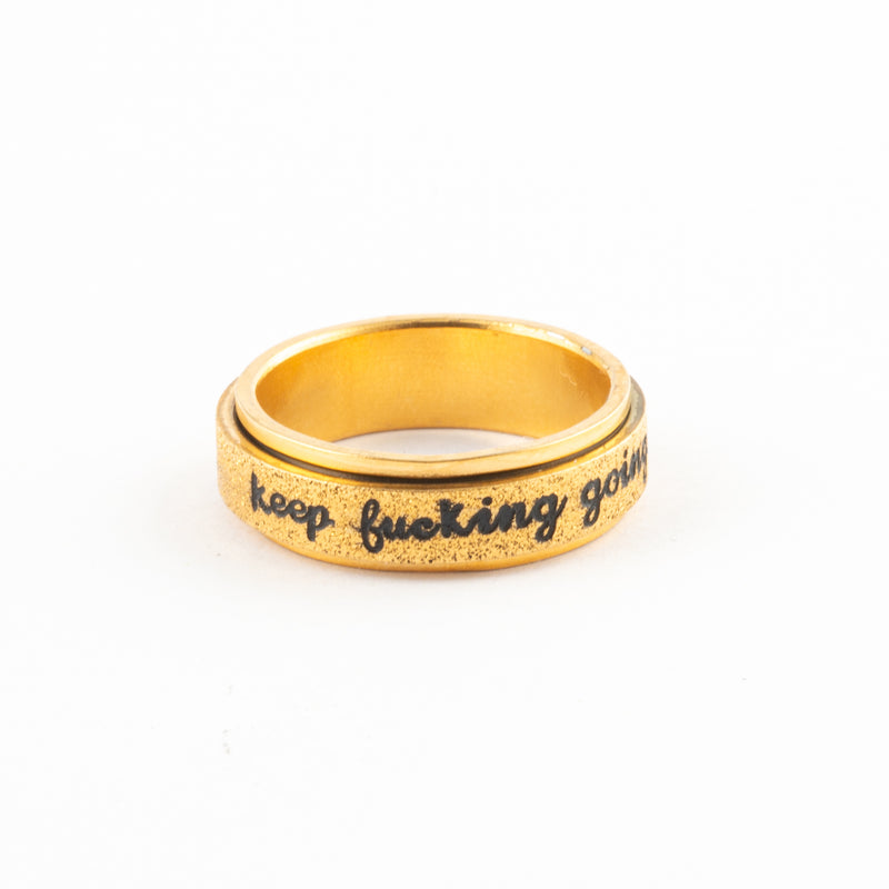 Anillo Anti-Estrés Deslizante Keep fuck*ng going Dorado