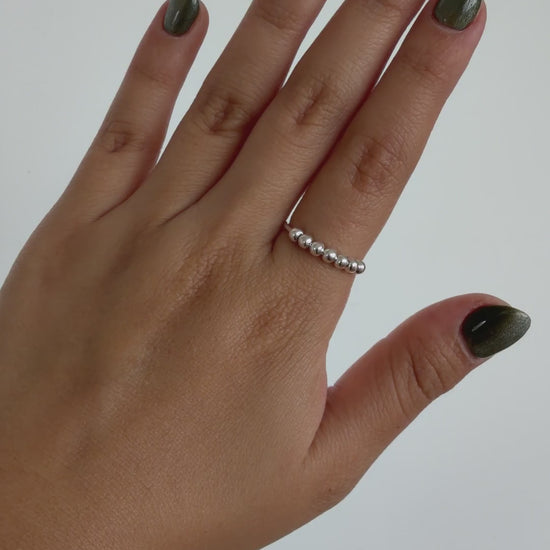 Anillo Anti-Estrés Plata S925 Abaco Plateado — video del producto girando en la mano